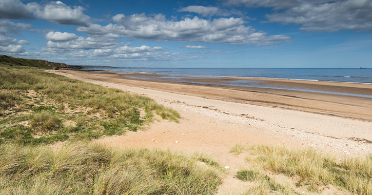 view of the sandy beach at Crimdon Dene Beach, County Durham.